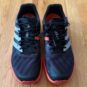 adidas Black Shoes with Red Soles and Gray Stripes